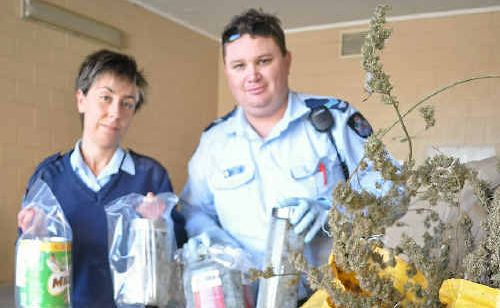 Constable Jade Fleming and Senior Constable Jeremy Lambert with the drugs seized from two addresses last week. Constable Jade Fleming and Senior Constable Jeremy Lambert with the drugs seized from two addresses last week.